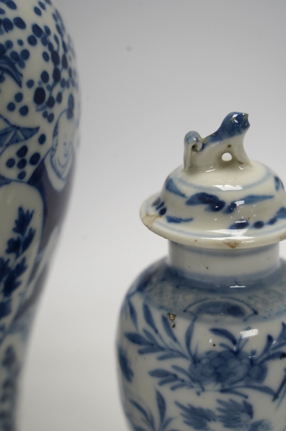 Ten Chinese blue and white baluster jars and covers including prunus flower examples, 19th century and later, tallest 35cm. Condition - poor to fair